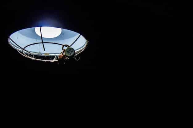 A concept image of a large space telescope deploying a starshade, a separate spacecraft flying millions of miles away to block starlight, enabling direct imaging of distant exoplanets. The starshade has a complex, petal-like design.