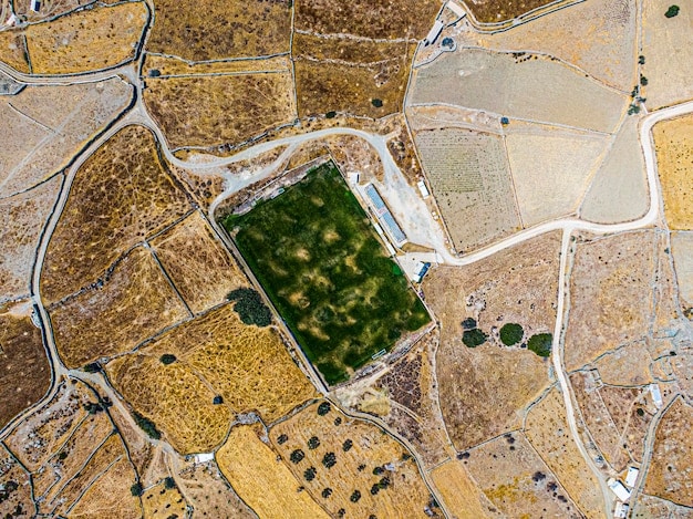 A detailed satellite image showing agricultural fields with varying levels of crop health, overlaid with data points indicating precision agriculture applications.