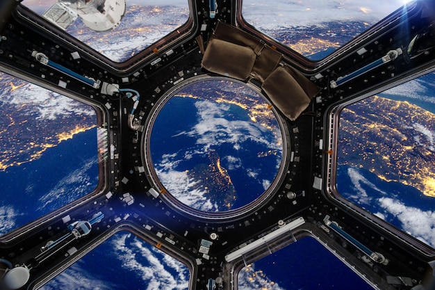 A detailed artist's impression of the James Webb Space Telescope in deep space, with Earth in the background. Its golden mirrors are reflecting starlight, and a faint shimmering exoplanet is visible in the distance, representing its exoplanet characterization capabilities.
