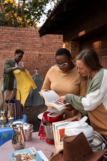 A group of diverse students and community volunteers actively participating in a cultural heritage workshop outdoors, learning about site documentation from an archaeologist, with a historical building partly visible in the background.