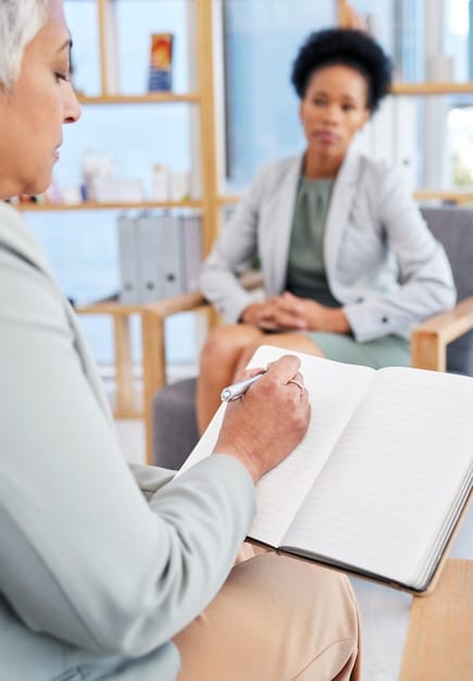 A photo showcasing a counseling session where a healthcare provider is discussing MAT options with a patient, emphasizing the integration of medication and therapy for effective opioid addiction treatment as part of What Are the Latest Developments in the US Opioid Crisis and Treatment Efforts?.