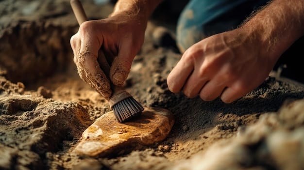 Close-up of an archaeologist carefully brushing dirt away from a pottery shard during an excavation. The light is focused on the archaeologist's hands and the delicate artifact. Intricate designs on the pottery shard are clearly visible, reflecting the rich cultural history and highlighting the importance of archaeological finds. The setting appears to be a controlled and meticulously documented environment.