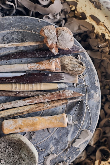A collection of excavated artifacts from Jamestown, including pottery shards, tools, and weapons, displayed in a museum case. The artifacts reveal details about the daily life and challenges faced by the early European settlers during The Search for Lost Colonies: Uncovering the Truth Behind Early European Settlements in North America