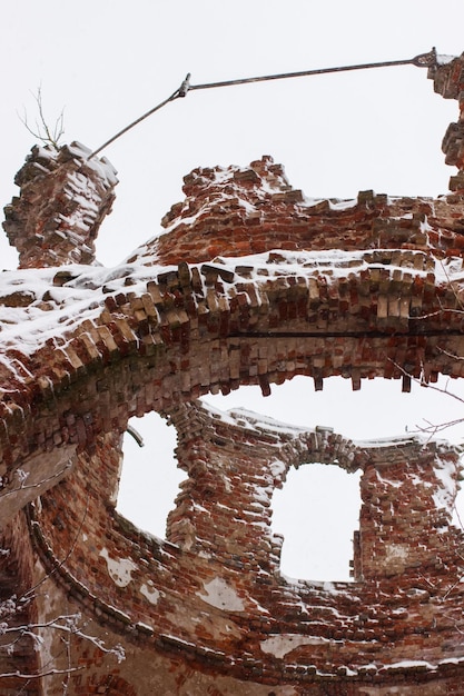 A close-up photograph of a partially excavated section of a Revolutionary War-era fortification. The image highlights the layers of soil, revealing the remnants of wooden palisades, a stone foundation, and scattered artifacts such as broken pottery shards and rusty tools. The Archaeology of Conflict: Unearthing Battlefields and Fortifications from US History is visible in these layers.