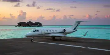 Luxury private jet on tropical island runway, exclusive celebrity vacation spot